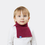 Elio, aged 3, wears a mini stan dickey in berry