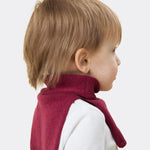 Elio, aged 3, wears a mini stan dickey in berry