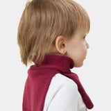 Elio, aged 3, wears a mini stan dickey in berry