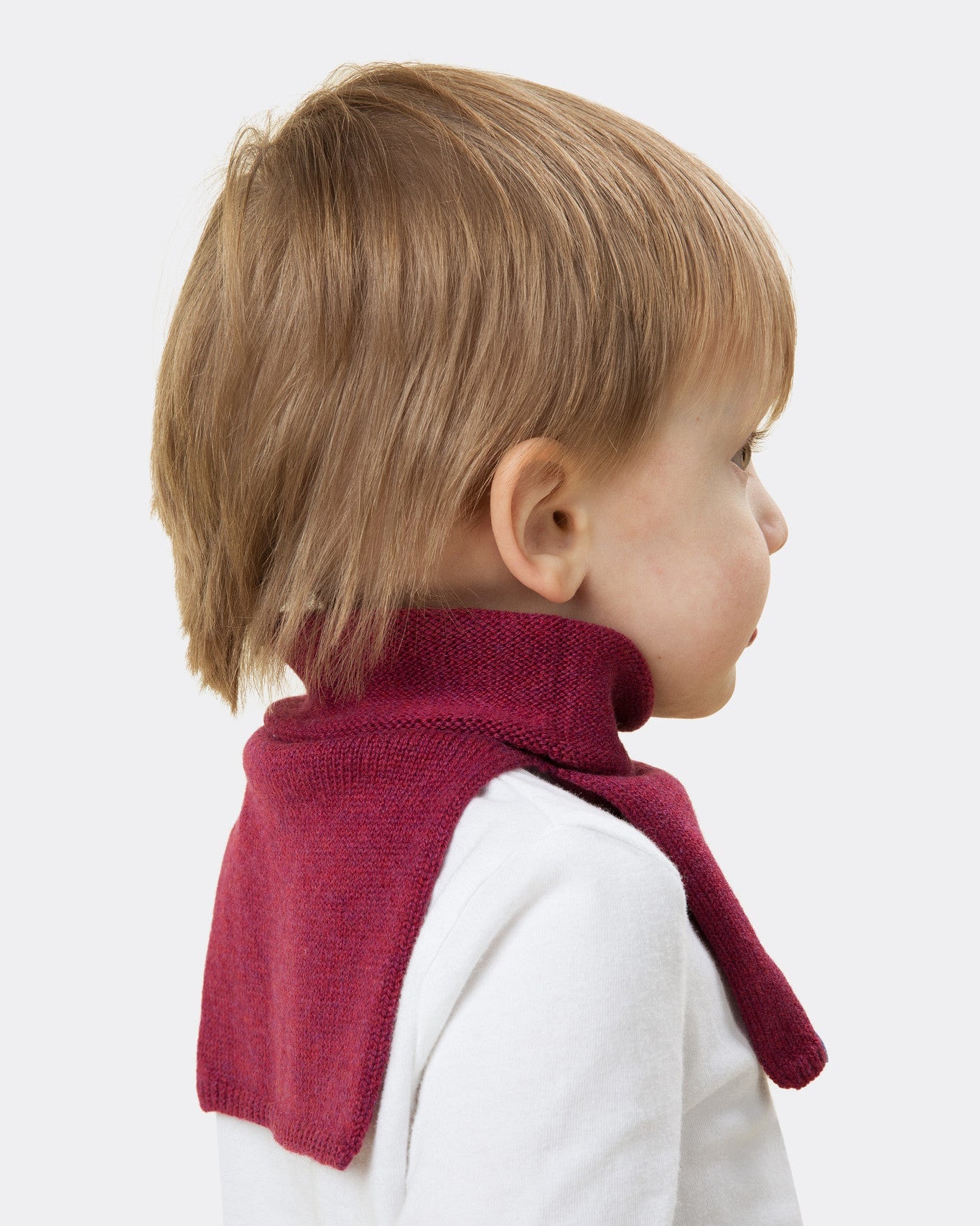Elio, aged 3, wears a mini stan dickey in berry