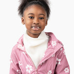 Khali, age 7, wears a small stan in blanc